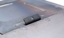 Close-up of the Yoder Smokers YS640 Two-Piece Heat Diffuser by Yoder Smokers, showing its raised tab, central circular hole, and rectangular cutouts on a flat metal surface with visible weld marks.
