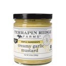 Terrapin Ridge Farms Creamy Garlic Mustard is a gluten-free, artisan 8.5 oz spread—perfect for pretzels or sandwiches, with a yellow and white label, black text, and a black lid.
