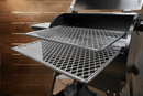 Two carbon steel Pimp My Grill® Gen2 Slide-Out Rack System racks installed inside a Grilla Grills Silverbac pellet grill.