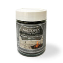 A 4 oz jar of SALTOPIA Infused Sea Salts, "Best Grilling Salts: Thrills for the Grill," features a campfire label—ideal for grilling or BBQ seasoning. Find more at SALTOPIA.com.