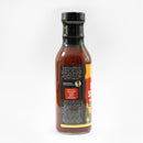 A bottle of Chiles & Smoke Smoky Sonoran BBQ Sauce by Chiles and Smoke with a black cap, featuring a partially visible label that recommends pairing with chicken, pork, and veggies, is displayed against a white background. This smoky barbecue sauce is an ideal grilling companion to enhance your favorite dishes.