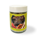 A jar of SALTOPIA Infused Sea Salts labeled "Best Grilling Salts: Thrills for the Grill," featuring grilled chicken and citrus imagery. It has a white lid and bright yellow background, perfect BBQ seasoning for your next cookout.