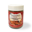 A 4 oz clear jar with a white lid contains SALTOPIA Infused Sea Salts' Southwestern Flavor Low Sodium: YACK-ety YACK, featuring bold Southwestern seasoning and a red label with southwestern-style food.