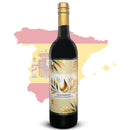 A bottle of Georgetown Olive Oil Co. Gold Harvest Spanish Extra Virgin Olive Oil, known for its ultra high polyphenols and representing the best of Spain, is placed in front of an outline of Spain with the Spanish flag in the background, emphasizing its authentic heritage.