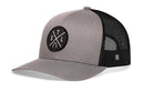The Haka Hat St. Louis Trucker Hat | Gray-Black STL X Snapback features mesh back panels, a curved brim, and a round black embroidered STL X patch with white letters—ideal for fans of classic St. Louis trucker hats.