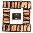 Individually vacuum-sealed cuts from the Dude Food Chicks Meat Box are arranged in a square around a Dude Food sign featuring beef, chicken, and pork icons. Each portion is packaged separately on black trays, including hand-trimmed chicken and boneless skinless chicken breasts for a premium natural chicken selection.