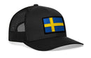 The Haka Hat Swedish Flag Trucker Hat is a black snapback by Haka Hat, featuring a mesh back and an embroidered patch of the blue-and-yellow Swedish flag on the front.