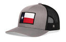Show your Texas pride with the Haka Hat Texas Flag Trucker Hat by Haka Hat. This gray-black snapback features a front patch of the state flag with white star, blue vertical, and red and white horizontal stripes for classic style.