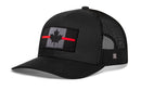 The Haka Hat Thin Red Line Trucker Hat by Haka Hat features a black mesh design and a gray front panel with a Canadian maple leaf flag patch and two bold red diagonal lines.