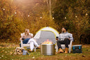 Timberwolf Smokeless Portable Fire Pit 22 inch stainless steel at DDR BBQ Supply lifestyle shot by campfire
