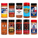 Ten colorful bottles from the DDR BBQ Supply "Top 10 Store-Bought BBQ Chicken Rubs Variety Pack" are arranged in two rows. Each bottle features a distinctive label with bright colors and varied fonts, highlighting different brands and flavors of BBQ chicken rubs and championship chicken seasonings.