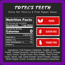 The label for Harmacy Hot Sauce Co. Totec's Teeth Extra Hot Pasilla & Plum Sauce 9oz shows nutrition facts, vegan, gluten free, and peanut free icons, plus ingredients—all on a dark background. This extra hot sauce delivers intense heat from super-hot peppers.