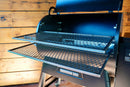 A Traeger Ironwood 885 featuring a Pimp My Grill® Gen2 Slide-Out Rack System with two expanded metal slide-out racks extended from the main cooking chamber.