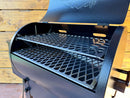 Open Traeger Tailgater / Junior Pimp My Grill® Pro Series Slide-Out Rack System with two stacked, slide-out metal diamond-pattern cooking racks.