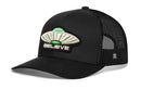 The Haka Hat Believe Trucker Hat is a black mesh snapback with Alien UAP embroidery, a stitched white and green UFO, “BELIEVE” text on the front, Haka signature 5.0 details, and a curved brim.