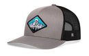 The Haka Hat Diamond Mountain and Trees Trucker Hat features gray fabric front panels, black mesh back, a mountain scene patch, and a classic snapback closure. Brand: Haka Hat. Color: Gray-Black.