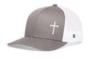 The Haka Hat Cross Trucker Hat is a gray and white snapback featuring a simple white cross on the front and a small tag with a black geometric logo on the mesh side.