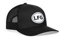 The Haka Hat LFG Trucker Hat features black mesh, a white oval patch with bold black “LFG” letters on the front, and an adjustable snapback closure. This Black Lets Go Snapback is from the Haka Hat brand.