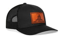 The Haka Hat Dont Tread on Me Trucker Hat is a black snapback featuring a brown Gadsden leather patch with a coiled rattlesnake and bold lettering, styled in the classic HAKA signature trucker design.