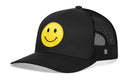 The Haka Hat Smiley Face Trucker Hat is a black snapback by Haka Hat, featuring a yellow emoji patch on the front and black mesh on the back.