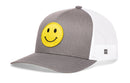 The Haka Hat Smiley Face Trucker Hat by Haka Hat features a gray and white design, bright yellow embroidered emoji patch, curved brim, structured crown, and comfort-fit sweatband for all-day wear.