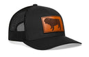The Haka Hat English Bulldog Trucker Hat features a black mesh design with a brown leather patch displaying an English bulldog silhouette on the front.