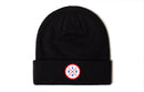 The Haka Hat USA Beanie | Black USA X is a black knit beanie by Haka Hat, featuring a circular woven patch with "USA" and a blue star.