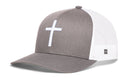 The Haka Hat Cross Trucker Hat is a gray-white snapback featuring a bold white cross on the front panel, mesh back, and small side label.