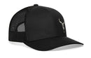 The Haka Hat Bull Skull Trucker Hat is a black snapback from Haka Hat, featuring a mesh back and a small white bull skull graphic on the front left.