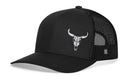 The Haka Hat Bull Skull Trucker Hat by Haka Hat features a white bull skull logo on the front, black mesh sides and back, a curved bill, and an adjustable snapback for breathable comfort.