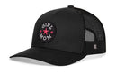 The Haka Hat Girl Mom Trucker Hat is a black snapback with a mesh back and a front round patch embroidered with “Girl Mom” in white and two pink stars.