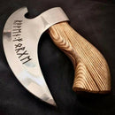 The Texan Knives Axe Pizza Cutter features a J2 steel blade custom engraved with runes and a smooth, light brown wooden handle with visible grain, displayed on a dark surface.