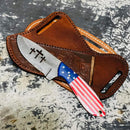 The Texan Knives Cowboy Switchblades – Custom Handmade 8-Inch J2 Steel Blade features three cross cutouts and an American flag handle, resting on a tooled brown leather sheath.
