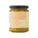 A glass jar with a black lid containing a yellowish mixture, labeled with ingredients and nutritional information on the back in multiple languages. The text lists vegetables and spices, indicating this is Taycte Famiglia Crispino Italian Mixed Vegetable Antipasto — marinated garden vegetables in EVOO by Taycte, an authentic Italian antipasto inspired by Calabrian traditions.