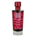 A clear glass bottle with a red label contains Taycte Pomegranate Balsamic Vinegar of Modena. The label, featuring text in Italian, English, and German, highlights this exquisite balsamic vinegar by Taycte delicately blended with pomegranate.