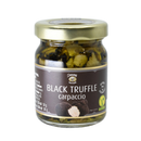 A glass jar with a gold lid labeled Taycte Black Truffle Carpaccio from Taycte. The jar contains sliced Tuber Aestivum black truffles, and the label features vegan and gluten-free symbols.