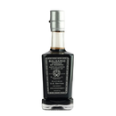 A bottle of Taycte Acetaia Malpighi Platinum IGP – High-Density Balsamic Vinegar of Modena, aged over 25 years, features a silver cap and black label adorned with white text and elegant patterns. Crafted by the renowned Malpighi family under the Taycte brand, this Platinum U.S. Edition balsamic vinegar guarantees exceptional quality and a rich, complex flavor.