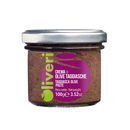 A glass jar of Taycte Taggiasca Olive Spread (Crema di Olive Taggiasche) with a silver lid, purple label, and green text displaying the product name and weight, 100g (3.52oz). This authentic Italian olive spread by Taycte is made from prized Ligurian olives for exceptional flavor.