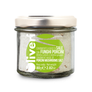 A small glass jar with a metal lid contains Taycte Porcini Mushroom Salt (Condimento a Base di Sale con Funghi Porcini), an umami seasoning blend. The green and white label displays product information in Italian and English, including the weight of 80 g (2.82 oz) and the brand name Taycte. Made in Italy, this gourmet salt adds rich flavor to any dish.