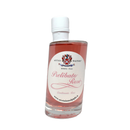 A clear glass bottle with a white cap contains pink liquid. The white label reads “Taycte Acetaia Malpighi Prelibato Rosé Balsamic Vinegar — Pink Italian Condimento, Delicate & Fruity” and features a crest, decorative text, and website information, presenting this elegant Taycte condiment as a refined, delicately fruity rose-infused dressing ideal for gourmet cuisine.