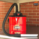 A WPPO LLC Direct 18V Rechargeable Ash Vacuum With Bonus Value Pack in red is displayed on a metal shelf, featuring a black hose and silver attachment with a HEPA filter. The background shows a brick wall and the WPPO logo alongside the "GET FIRED UP" text.