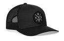 The Haka Hat Vermont Trucker Hat is a black mesh snapback with a curved brim and a front patch displaying "VER" and a small graphic in a cross pattern.