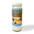 A glass jar of SALTOPIA Infused Sea Salts’ Vanilla Bean Sugar: BEAN GOOD, with a blue label showing vanilla beans and cookies. The 16oz jar contains gourmet vanilla sugar made from raw cane sugar.