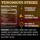 Sauce label for Elijah’s Xtreme Venomous Strike (Reaper Hot Sauce) by Elijah’s Xtreme, showcasing nutrition facts, a detailed ingredient list, and icons denoting award recognition, vegan/gluten-free status, no MSG or extracts, and calorie information—all presented on a vibrant sunset background. This Carolina Reaper hot sauce lives up to its bold name with intense flavor.
