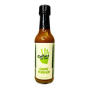 A 5 fl oz (148 ml) bottle of Culture Hot Sauce Carpe Verdiem from Culture Hot Sauce, featuring a green handprint design on the front. This hot sauce delivers the vibrant flavors of a tropical green salsa blended with hints of pineapple guava verde sauce.
