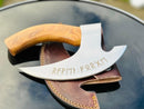 The Vikings Pizza Cutter by Texan Knives features a custom handmade 8-inch J2 steel blade and polished wooden handle, engraved with runes, resting on a brown leather sheath atop a black surface.