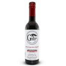 A bottle of Georgetown Olive Oil Co. Sherry Vinegar - Pedro Ximenez (SPAIN), distinguished by a red cap and a white label with black and red text displaying product information and company location. Inspired by the rich tradition of Spanish sherry vinegars, this expertly crafted selection captures the depth and complexity characteristic of barrel aged Pedro Ximenez sherry vinegar.
