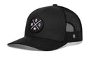 The Haka Hat Washington DC Trucker Hat features a black design with a round front patch of crossed white lines, W, D, C letters and star; classic snapback with curved bill and mesh back. Brand: Haka Hat.
