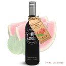 A bottle of Georgetown Olive Oil Co. Watermelon Mint White Balsamic, featuring its branded label, is displayed in front of fresh watermelon slices and mint leaves. The words SIGNATURE FLAVORS appear in the bottom right corner.