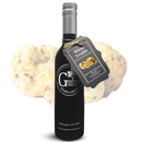 A bottle of Georgetown Olive Oil Co. White Truffle Infused Balsamic, featuring a tag labeled "White Truffle," is displayed in front of two large white truffles on a white background, highlighting the luxurious flavors of Modena, Italy.